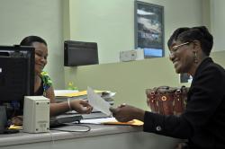 On St. Croix, Republican Senate candidate Gwendolyn Hall Brady hands her filing documents to elections assistant Mari Felix. On St. Croix, Republican Senate candidate Gwendolyn Hall Brady hands her filing documents to elections assistant Mari Felix.